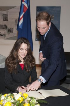 Kate Middleton signing something important