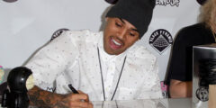 Chris Brown having an orgasm while writing an autograph